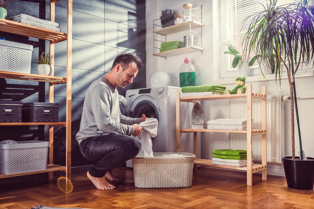 home-owner-removing-cloths-from-dryer