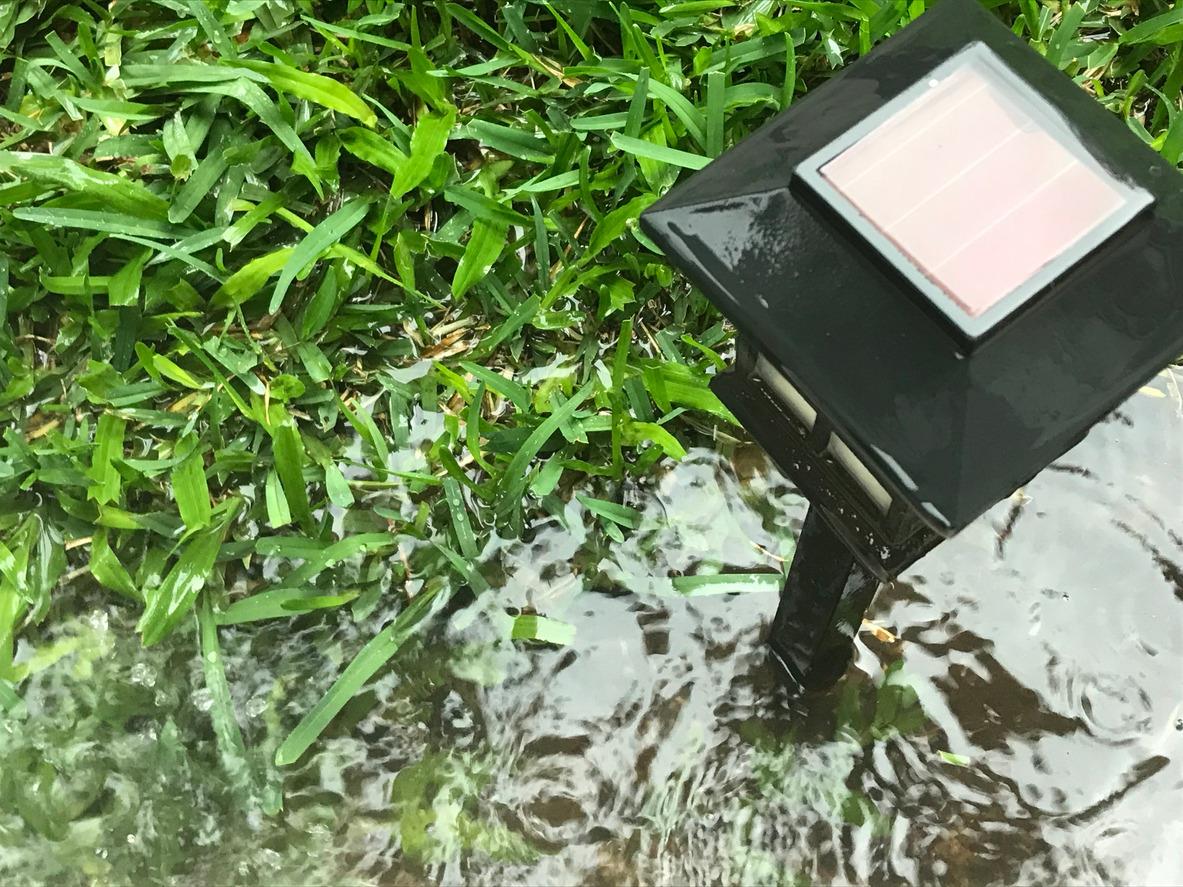 Puddle near light in yard
